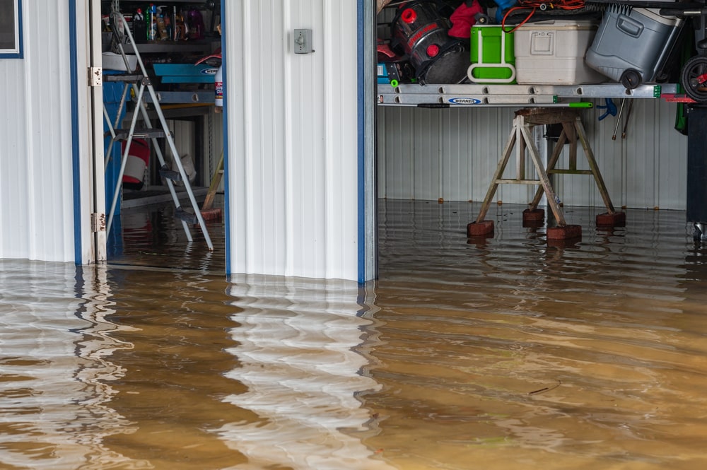 stock-photo-iberia-parish-l-a-usa-august-an-outdoor-structure-carport-and-shed-submerged-in-1813585660